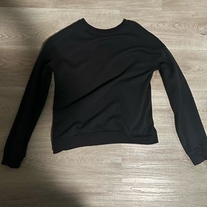 Plain black sweatshirt. Kids XXL but fits women like a S/M